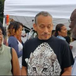 Dominica’s Ambassador Hubert John Charles chatting with members of the crowd